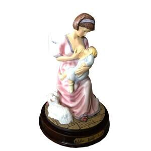 Da vinci figurine woman nursing child
